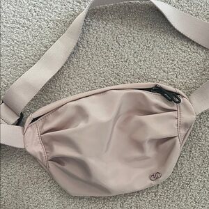 Calia by Carrie Underwood cross body champagne pink
